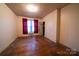 Bedroom with hardwood floors, a small window, and a closet providing ample storage space at 504 Glasgow Rd, Charlotte, NC 28214