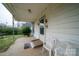 Inviting front porch featuring a ramp, seating, and a clear view of the home's entrance at 504 Glasgow Rd, Charlotte, NC 28214