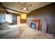 Spacious living room featuring a fireplace, soft sofa, and view of the home's interior at 504 Glasgow Rd, Charlotte, NC 28214