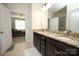 Double vanity bathroom with granite and a view of bedroom at 5063 Gribble Ln, Lancaster, SC 29720