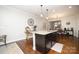 Kitchen island with granite countertops and dark cabinets at 5063 Gribble Ln, Lancaster, SC 29720