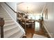 View down carpeted stairs showcasing an open floor plan at 5063 Gribble Ln, Lancaster, SC 29720