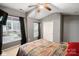 Bedroom featuring large windows and a light grey paint, with a decorative comforter on the bed at 528 Fawnborough Ct, Rock Hill, SC 29732