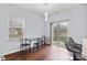 Dining area featuring hardwood floors, a modern chandelier, and sliding door access to the patio at 528 Fawnborough Ct, Rock Hill, SC 29732