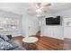 Bright living room featuring hardwood floors, ceiling fan, and staircase to the upper level at 528 Fawnborough Ct, Rock Hill, SC 29732