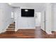 Open living room with wood floors, staircase, and neutral walls providing a welcoming space at 528 Fawnborough Ct, Rock Hill, SC 29732