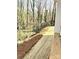 A mulched backyard with a wooded view at 553 W Lowrance Ave, Mooresville, NC 28115