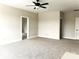 A bright bedroom with neutral carpet and a ceiling fan at 553 W Lowrance Ave, Mooresville, NC 28115