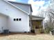 Exterior of home showcasing a white siding and a cozy back porch at 553 W Lowrance Ave, Mooresville, NC 28115