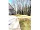 Spacious lot with a manicured lawn, trees, and a driveway alongside the house at 553 W Lowrance Ave, Mooresville, NC 28115