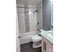 Bathroom with a shower/tub combo, white tile, and marble vanity at 704 W Border St, Dallas, NC 28034