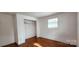 Bright bedroom with hardwood floors and a closet at 704 W Border St, Dallas, NC 28034