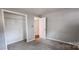 Bedroom with gray carpet and a closet at 704 W Border St, Dallas, NC 28034