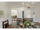 Dining room featuring hardwood floors, wainscoting, and an elegant chandelier at 7219 Yellowhorn Trl, Waxhaw, NC 28173