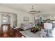 Inviting living room featuring hardwood floors and an elegant chandelier at 7219 Yellowhorn Trl, Waxhaw, NC 28173