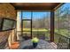 Screened-in porch with outdoor seating and a view of the backyard at 7219 Yellowhorn Trl, Waxhaw, NC 28173