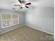 Bright bedroom with ceiling fan and large window at 7310 Sun Dance Dr, Fort Mill, SC 29707