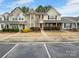 Two-story townhome with neutral siding and landscaping at 7310 Sun Dance Dr, Fort Mill, SC 29707