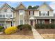 Two-story townhome with neutral siding and landscaping at 7310 Sun Dance Dr, Fort Mill, SC 29707