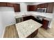 Kitchen with granite countertops and dark brown cabinets at 7310 Sun Dance Dr, Fort Mill, SC 29707