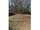 Large backyard with mature trees and shed at 784 Crestmont Se Dr, Concord, NC 28025