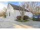 White brick garage with dark trim, providing ample storage space at 8478 Rocky River Rd, Harrisburg, NC 28075