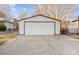 White single-car garage with a standard garage door at 8478 Rocky River Rd, Harrisburg, NC 28075