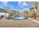 Relaxing pool area with a stone spa and privacy fence at 8478 Rocky River Rd, Harrisburg, NC 28075