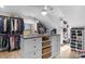 Bright walk-in closet with ample shelving and drawers at 8478 Rocky River Rd, Harrisburg, NC 28075