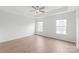 Bedroom featuring a ceiling fan and two windows with natural light at 8714 Summer Serenade Dr, Huntersville, NC 28078