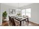 Dining room features a large table, chairs, and decor with a large window at 8714 Summer Serenade Dr, Huntersville, NC 28078