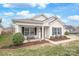 Charming home with a welcoming porch and landscaped front yard offers great curb appeal at 8714 Summer Serenade Dr, Huntersville, NC 28078