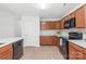 Kitchen featuring wood cabinets, stainless steel appliances, light countertops, and tiled backsplash at 8714 Summer Serenade Dr, Huntersville, NC 28078