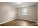 Bedroom featuring a window and hardwood flooring at 901 Wyke Rd, Shelby, NC 28150