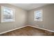 Bedroom featuring two windows and hardwood flooring at 901 Wyke Rd, Shelby, NC 28150