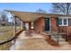 Cozy brick home featuring a covered carport, black shutters, and a freshly painted front door at 901 Wyke Rd, Shelby, NC 28150