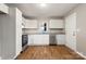 Modern kitchen with stainless steel appliances, white cabinets, and beautiful granite countertops at 901 Wyke Rd, Shelby, NC 28150