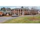 Two story brick building with columns and a well maintained lawn at 904 Mcalway Rd # B, Charlotte, NC 28211