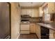 Cozy kitchen with light wood cabinets, and modern appliances at 904 Mcalway Rd # B, Charlotte, NC 28211