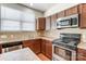 Kitchen with stainless steel appliances and tile backsplash at 104 N Canyon Ridge Dr, Mount Holly, NC 28120