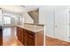 Kitchen island with granite countertop and wood cabinets at 104 N Canyon Ridge Dr, Mount Holly, NC 28120