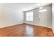 Spacious living room featuring hardwood floors and neutral walls at 104 N Canyon Ridge Dr, Mount Holly, NC 28120