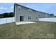 Spacious backyard with a white fence, a sliding glass door and a patio at 104 Sycamore Crossing Ct, Locust, NC 28097