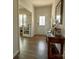 Bright entryway with hardwood floors, decorative table, and inviting view of rooms at 104 Sycamore Crossing Ct, Locust, NC 28097