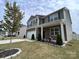 A charming two-story house features a two-car garage, well-kept lawn, and landscaped garden at 104 Sycamore Crossing Ct, Locust, NC 28097