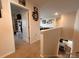 Upstairs hallway with neutral carpeting and white doors at 104 Sycamore Crossing Ct, Locust, NC 28097