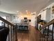 Open kitchen with white cabinets, granite countertops, and stainless steel appliances at 104 Sycamore Crossing Ct, Locust, NC 28097