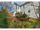 Backyard view of the deck and lush landscaping of the home at 10417 Sutherby Dr, Charlotte, NC 28277