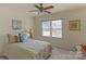 Sunny bedroom with a decorative wall art and a comfortable bed illuminated by natural light from the window at 10417 Sutherby Dr, Charlotte, NC 28277