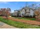 Elegant brick house showcases an inviting exterior with a well-maintained lawn and mature trees at 10417 Sutherby Dr, Charlotte, NC 28277